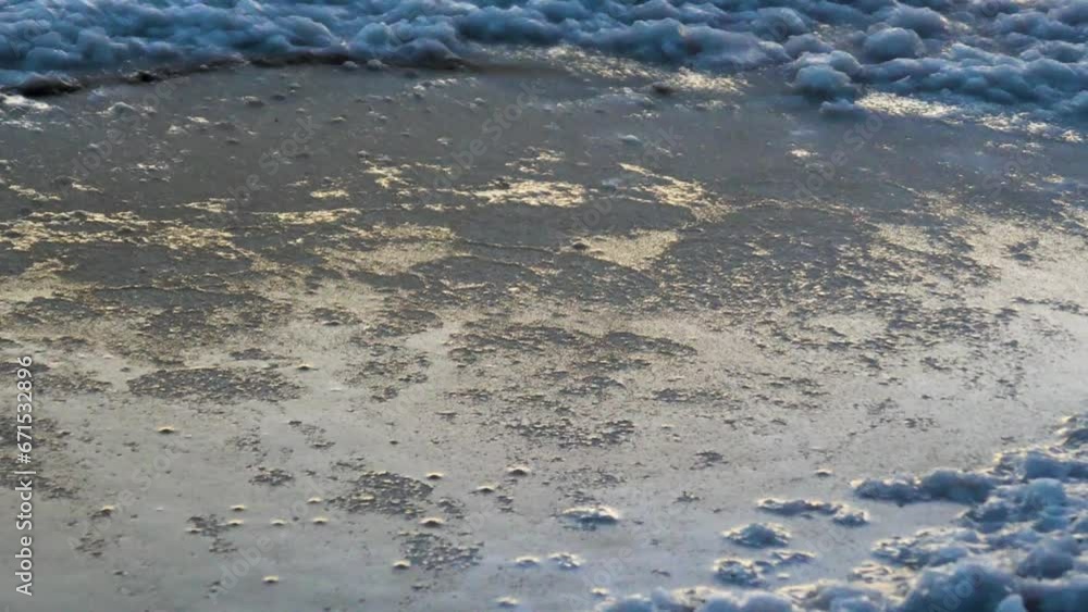 Evening coolness and as if the formation of ice. But it's not ice. A crust of salt forms in calm weather on the surface of the lake, as if it freezes (grease salt)