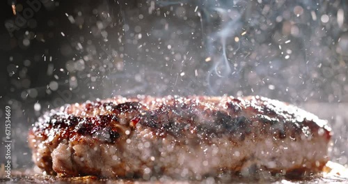 Pork cutlet for burger fried in frying pan. Cinematic advertising burger cooking. Sizzling cutlets fried in hot skillet tantalize taste buds. Close-up of delectable cutlets frying to perfection. Diet
