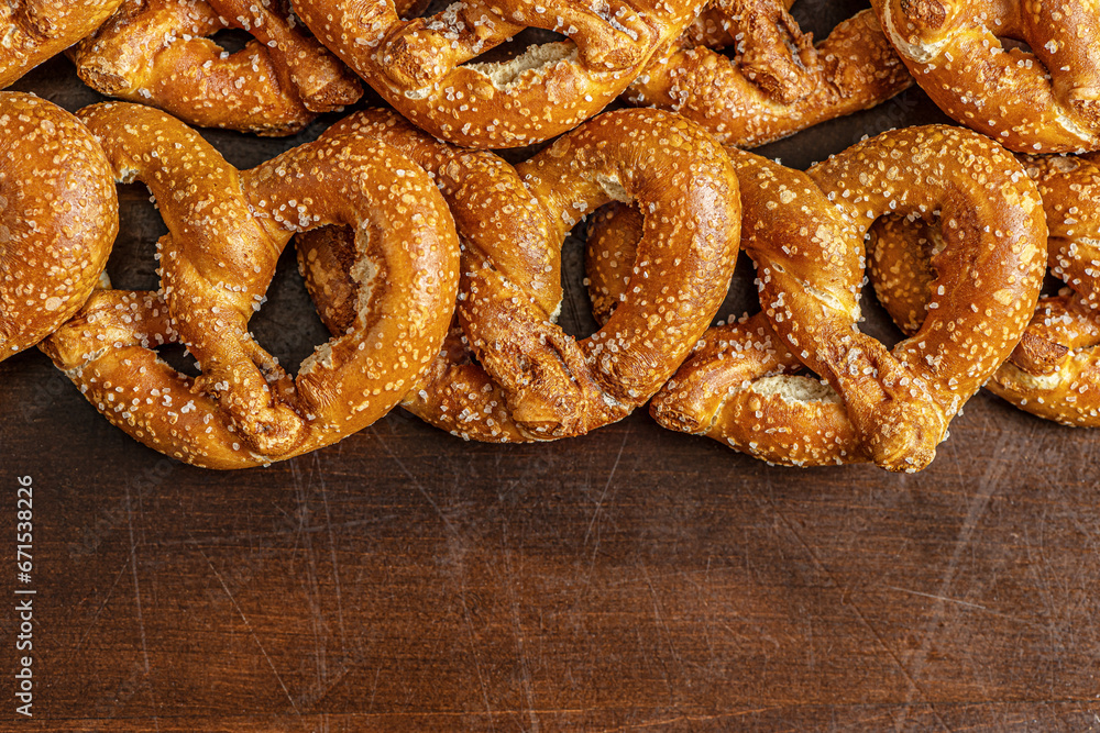 food background of pretzels on a wooden surface close up