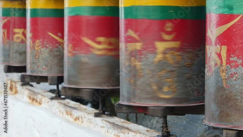 Spinning prayer wheels in McLeod Ganj, the current residence of the Dalai Lama, and an important place for Tibetan refugees in India photo