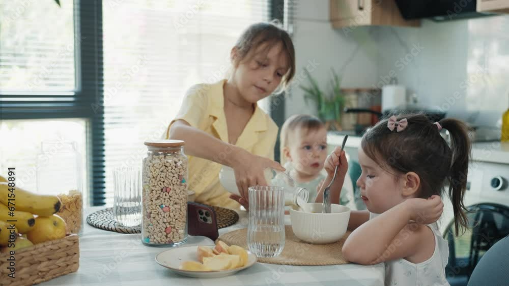 Three Little Girls Enjoy a Healthy Breakfast Three Little Girls Enjoy a Healthy Breakfast