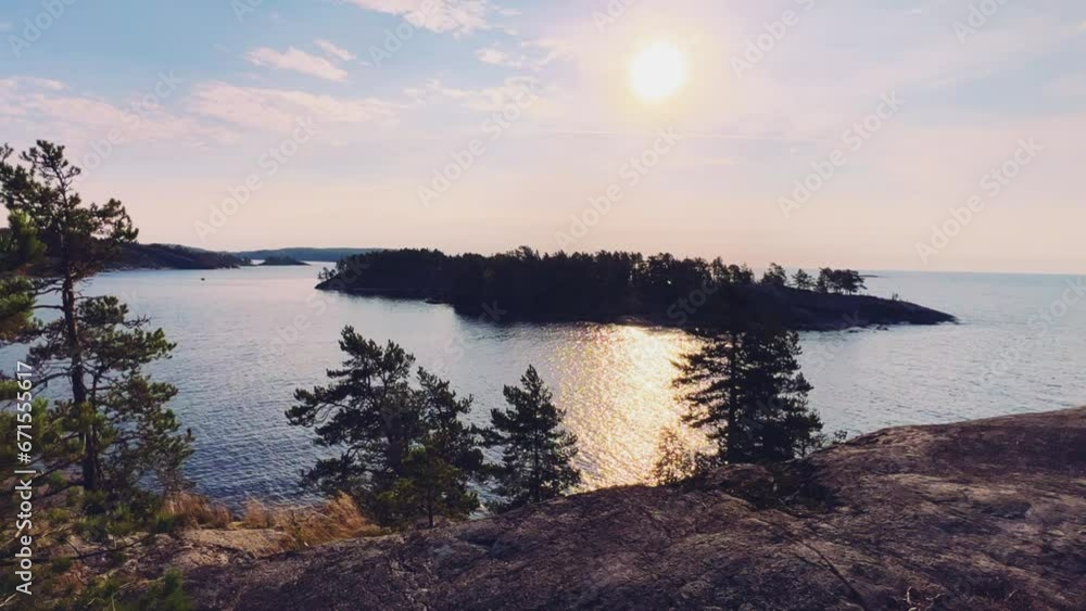 Russia, Karelia, Lake Ladoga, Koyonsaari. View of the coast of the island in a cold lake. Beautiful nature of the Republic of Karelia. Stunning panoramic view of the Ladoga Skerry Islands. 4K Russia, Karelia, Lake Ladoga, Koyonsaari. View of the coast of the island in a cold lake. Beautiful nature of the Republic of Karelia. Stunning panoramic view of the Ladoga Skerry Islands. 4K