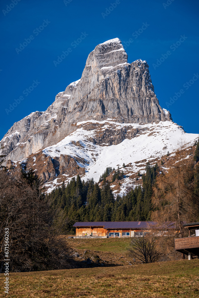 Fototapeta premium View of Braunwald in autumn with snow-capped Alps, Switzerland.