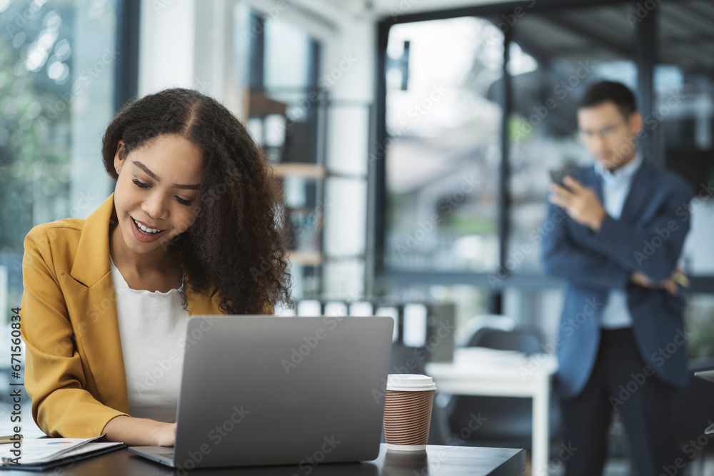 Businesswomen hand working with tablet and laptop computer with documents on office desk in modern office. Businesswomen hand working with tablet and laptop computer with documents on office desk in modern office.