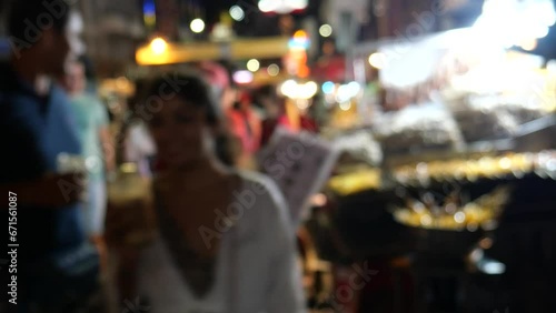 People in Bangkok's Chinatown. It is one of the world's largest and most renowned street food destinations. It is famous for amazing street food, lively dining, and authentic vibe.  photo