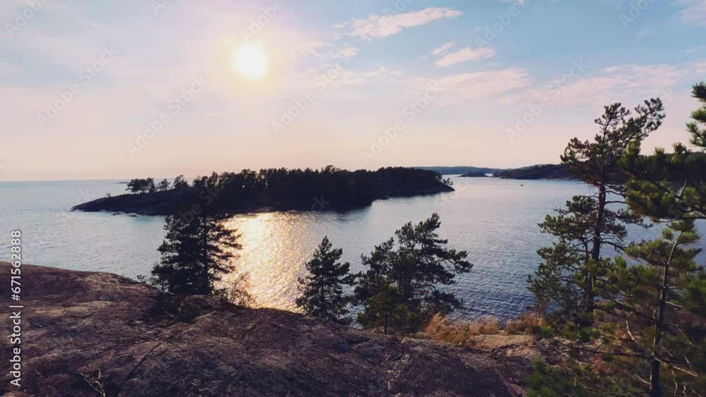 Russia, Karelia, Lake Ladoga, Koyonsaari. View of the coast of the island in a cold lake. Beautiful nature of the Republic of Karelia. Stunning panoramic view of the Ladoga Skerry Islands. 4K Russia, Karelia, Lake Ladoga, Koyonsaari. View of the coast of the island in a cold lake. Beautiful nature of the Republic of Karelia. Stunning panoramic view of the Ladoga Skerry Islands. 4K
