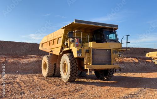 Mining truck in open-pit mining. Construction equipment on soil transport. Haul truck at construction site. Mining civil works and Earthmoving. Off highway Trucks on construction. Haul dump truck.