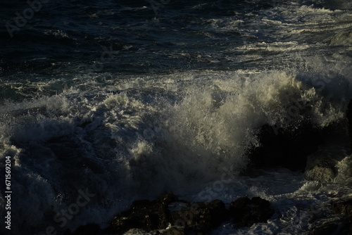 effects of waves and the ocean on the coast at sunset © alexisftv