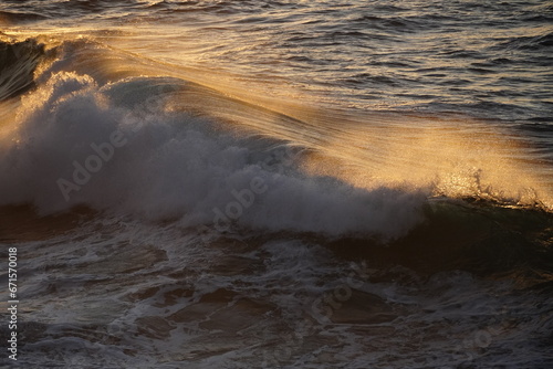 effects of waves and the ocean on the coast at sunset