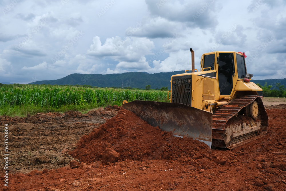 Dozer is pushing dirt. Bulldozer is working. Dozer is pushing dirt. Bulldozer is working.