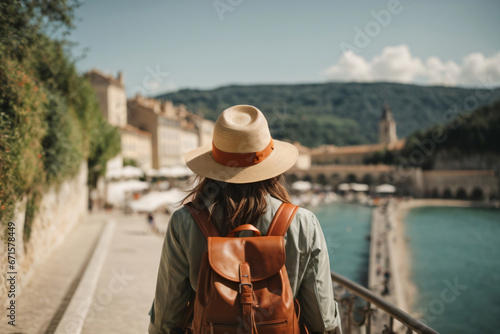 Back view of Tourist woman with hat and backpack at vacation in France, Wanderlust concept Generative Ai © Abdul