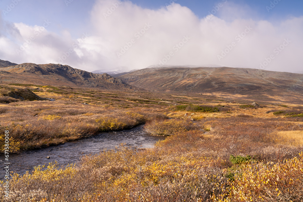 Typical landscape in Jotunheim National Park in Norway during autumn time in the Beitostølen area overlooking the Leirungsae River Typical landscape in Jotunheim National Park in Norway during autumn time in the Beitostølen area overlooking the Leirungsae River