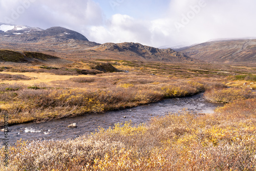 Typical landscape in Jotunheim National Park in Norway during autumn time in the Beitostølen area overlooking the Leirungsae River © Dreamnordno