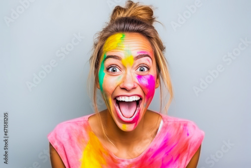 Colorful, joyous woman covered in paint after solo home renovation.