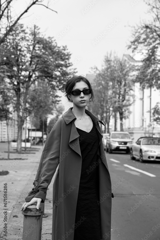 Black and white image of a elegant girl outside. Black and white image of a elegant girl outside.