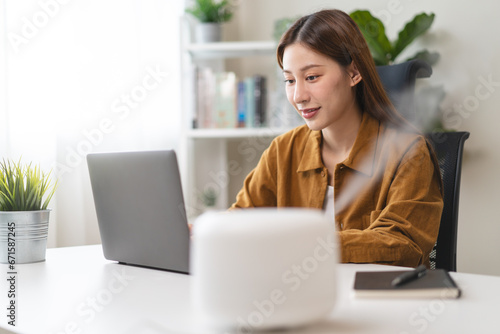 Air Humidifier Device At home and Woman relaxing during work