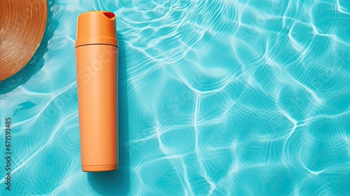 Orange tube with suntan lotion, cosmetic face cream or hand cream, shower gel, shampoo against the background of blue turquoise water with waves from the swimming pool. Body, Hair Skin care nature con
