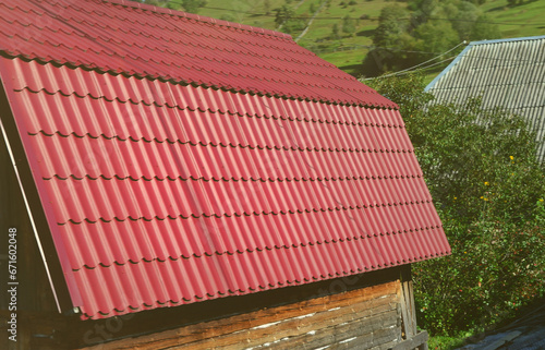 House with a roof made of solid metal sheets  shaped like an old tile