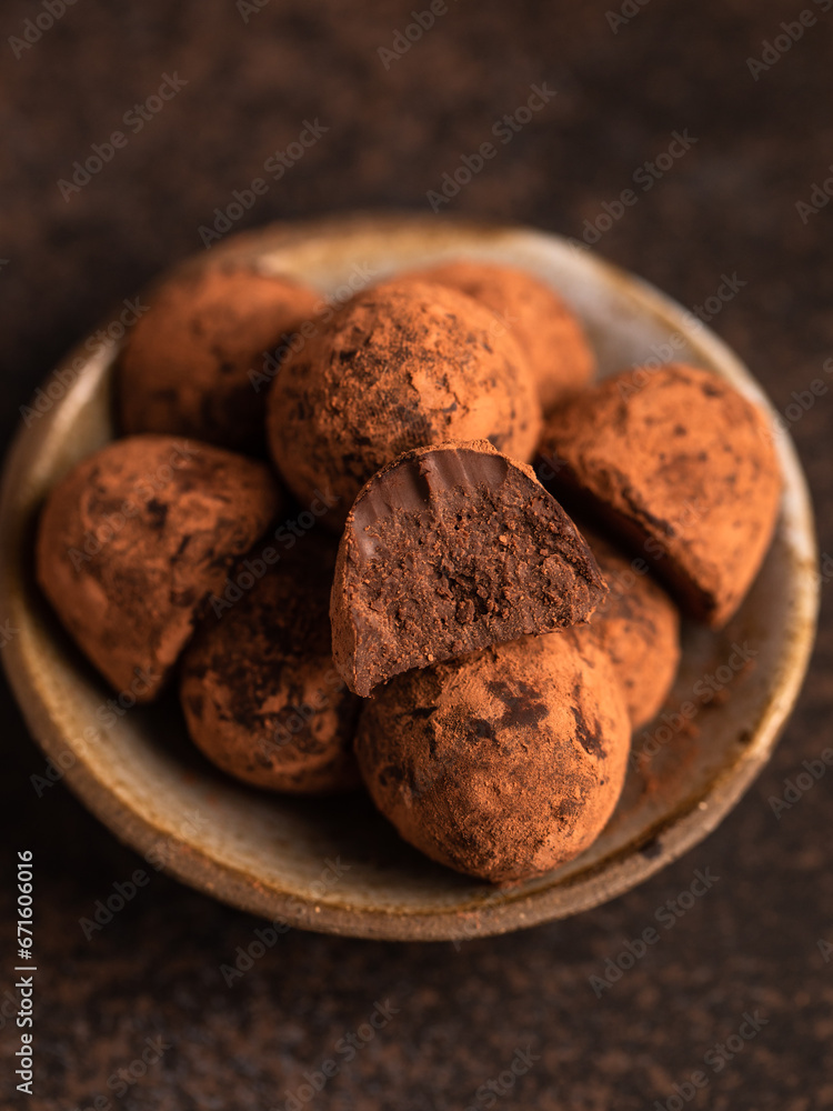 Homemade chocolate truffles with cocoa powder. Closeup view. Tasty sweet chocolate truffles Homemade chocolate truffles with cocoa powder. Closeup view. Tasty sweet chocolate truffles