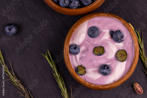 fresh purple and white yogurt with blueberries and blueberry berry flavor