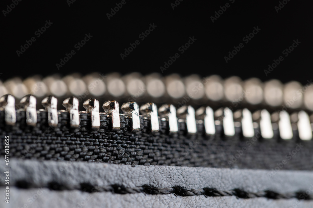 zipper on a black women's handbag close-up zipper on a black women's handbag close-up