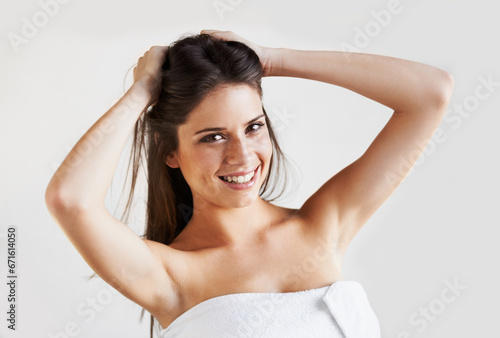 White background, skincare or portrait of happy woman after shower, cleaning and wellness routine. Face, results or female person with smile, glow or smooth skin after cosmetic dermatology in studio