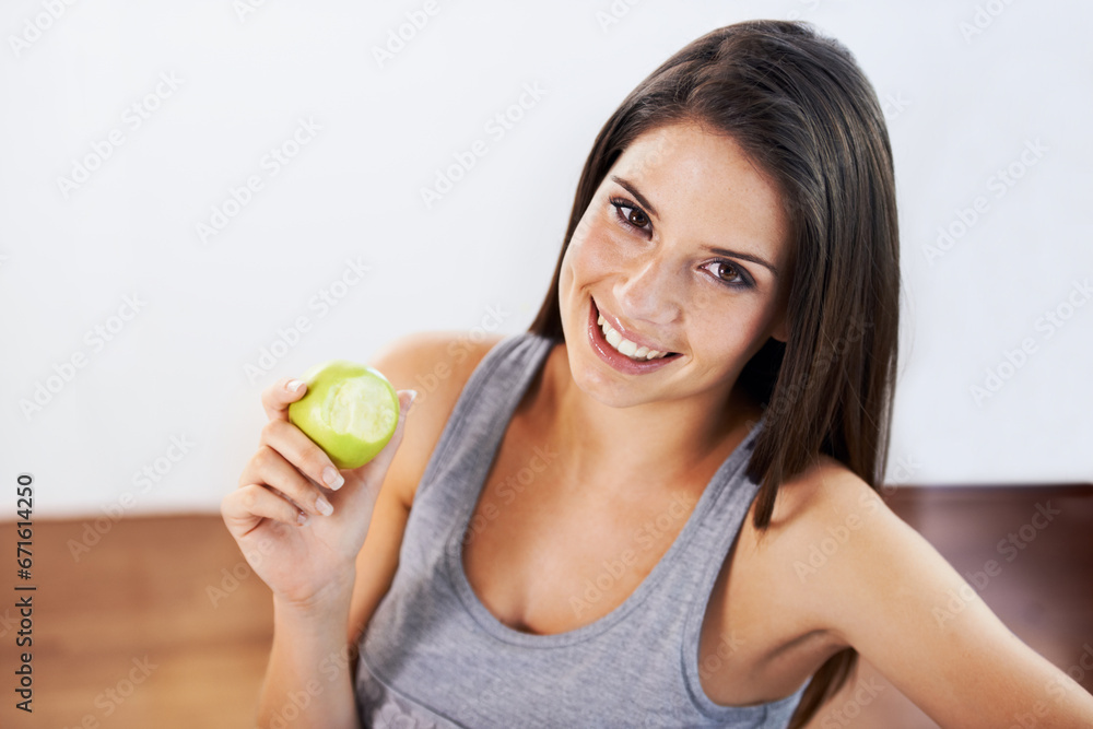 Portrait, smile and apple with a woman eating fruit for health, diet or nutrition in the kitchen of her home. Food, nutritionist and a happy young model in a house for organic wellness or weight loss Portrait, smile and apple with a woman eating fruit for health, diet or nutrition in the kitchen of her home. Food, nutritionist and a happy young model in a house for organic wellness or weight loss