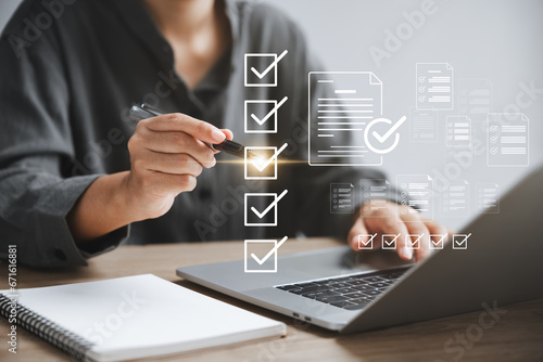 Business performance monitoring concept, businesswoman using laptop Online survey filling out, digital form checklist.