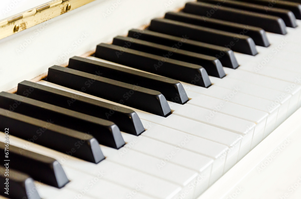 White piano. Piano keys close up, space for text. Piano keyboard White piano. Piano keys close up, space for text. Piano keyboard