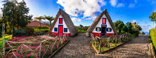 Madeira island travel and landmarks. Folk Museum in Santana town. Charming traditional colorful houses with thatched roofs, popular tourist attraction in Portugal photo