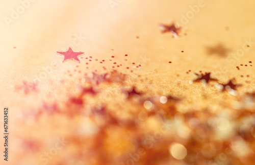 Golden Stars Over Gold Background. Gold Stars With Some Out Of Focus.