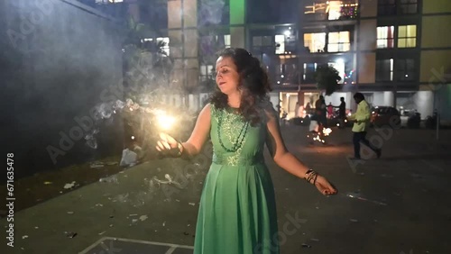 Woman with lights of fireworks. Sparkles lights. Diwali fireworks, Festival of lights. Deepawali festival. Hindu holidays. Seasonal. Firecrackers lights.