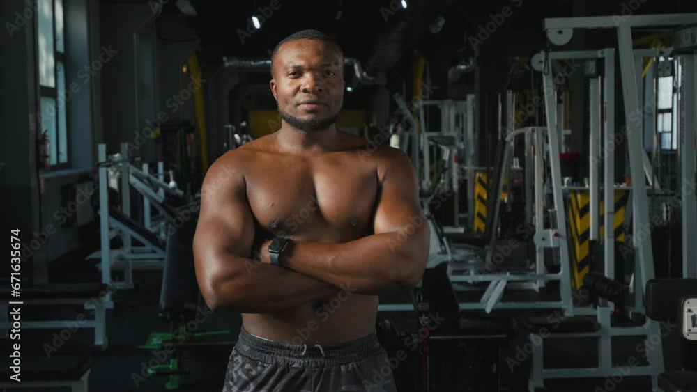 Shirtless black sportsman poses for post-workout photo with smile Shirtless black sportsman poses for post-workout photo with smile