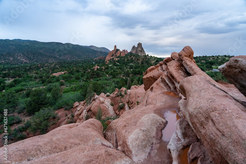 A view of rock formations in Garden of the Gods around sunset, in Colorado Springs, CO on a cloudy summer evening  photo