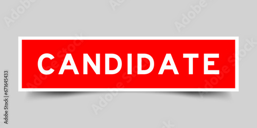Red color square label sticker with word candidate on gray background