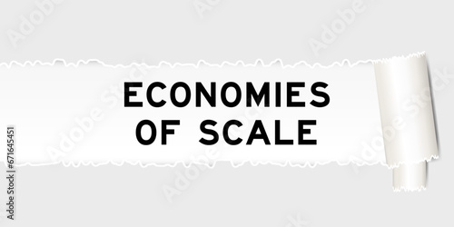 Ripped gray paper background that have word economies of scale under torn part