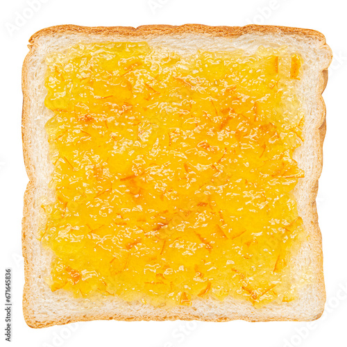 Spread marmalade jam on a slice of bread photo