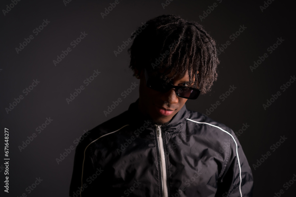 Dark portrait of an african cool young man in studio
