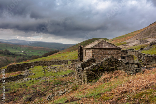 The ruins of Crackpot Hall, an 18th century farmhouse that has been abandoned to dereliction for many decades. near Keld, Upper Swaledale, North Yorkshire, UK
