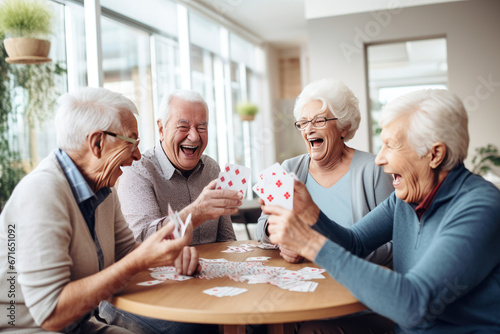 Joyful group of seniors playing cards and sharing laughter in a retirement nursing home