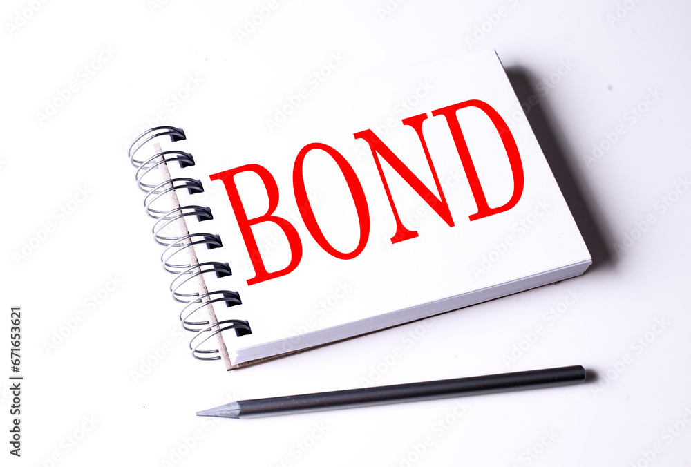 Text BOND on notebook on the white background, business Text BOND on notebook on the white background, business