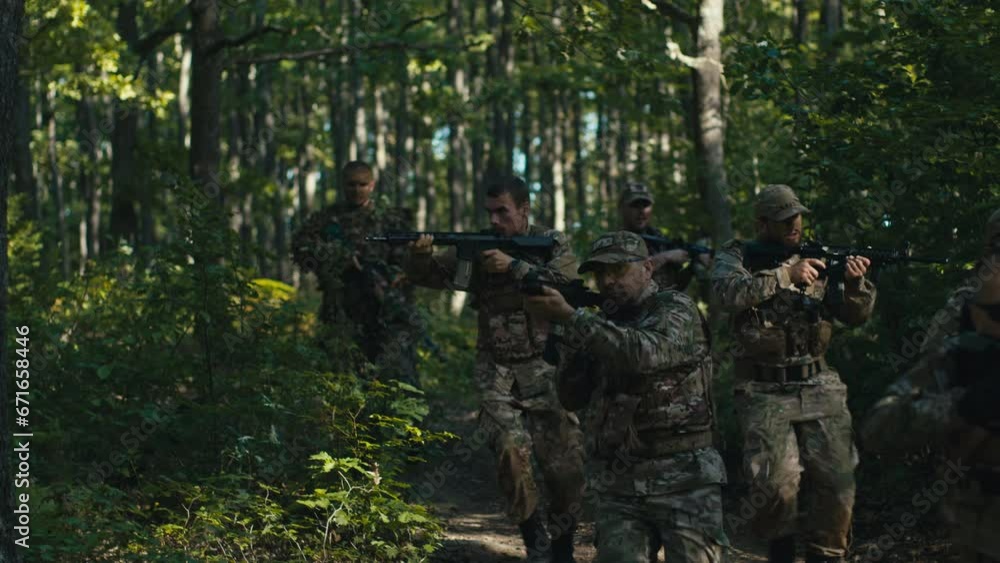 Soldiers Running Through the Forest While a Drone Follows Them Soldiers Running Through the Forest While a Drone Follows Them