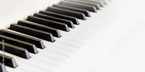 Close up of black and white piano keys. Shallow deep of field. blur, horizontal banner