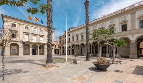 Town hall with flags and paved square in Vilassar de Mar photo