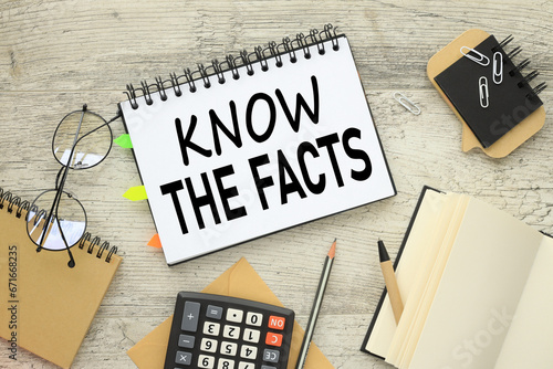 Wallpaper Mural know the facts text in the middle of the table near the calculator and glasses Torontodigital.ca