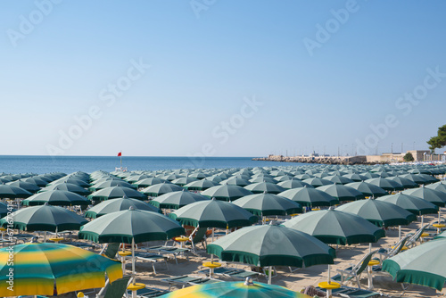 parasols on the sandy beach in Manfredonia town, photo