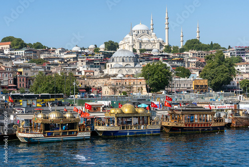 Sehzade Mosque with old Boats on Bosphorus, Istanbul, Turkey photo