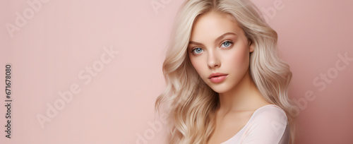 portrait of a young blonde woman on a pastel pink background, skincare, health products, make-up, hairstyling, fashion © RemsH