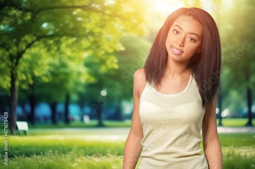 Portrait of smiling young woman posing outdoor