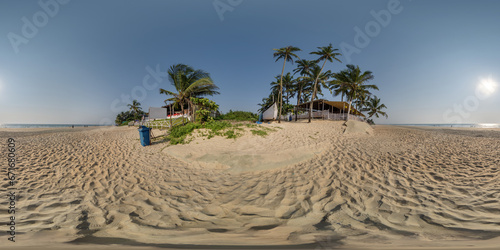 Fototapeta Naklejka Na Ścianę i Meble -  360 hdri panorama with coconut trees on ocean coast near tropical shack or open air cafe on beach in equirectangular spherical seamless projection